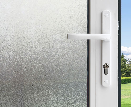 Gila® Ice Chips Decorative Window Film on sliding glass door